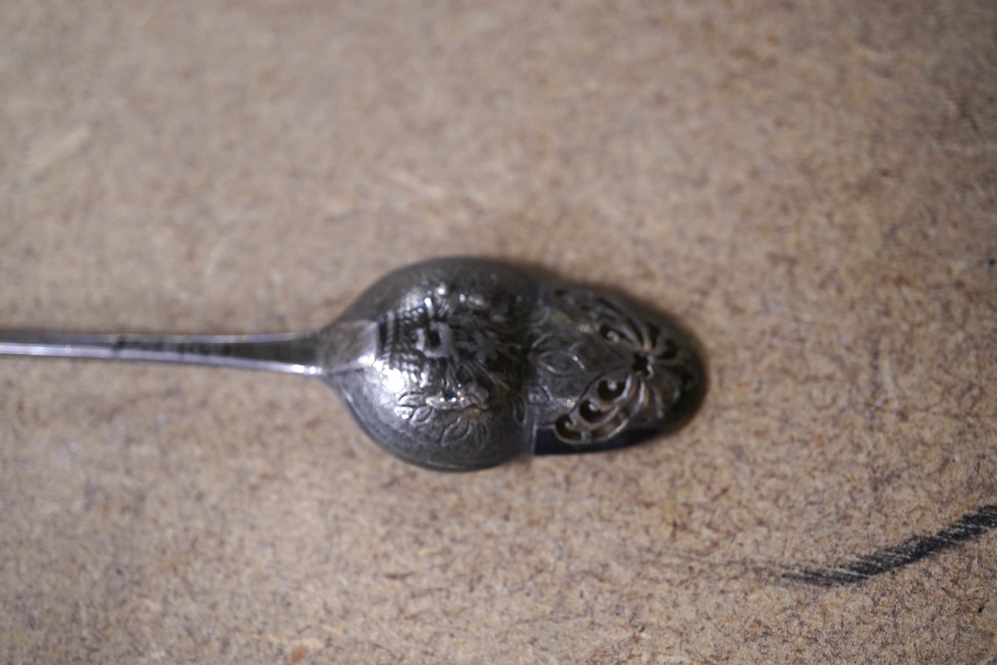 A George II silver mote spoon with acorn shaped picture back bowl, maker's mark for Elizabeth Oliver, circa 1755, 13.6cm. Condition - fair